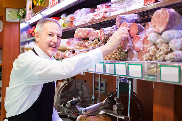 istock Shopkeeper at work in a grocery store 497413927