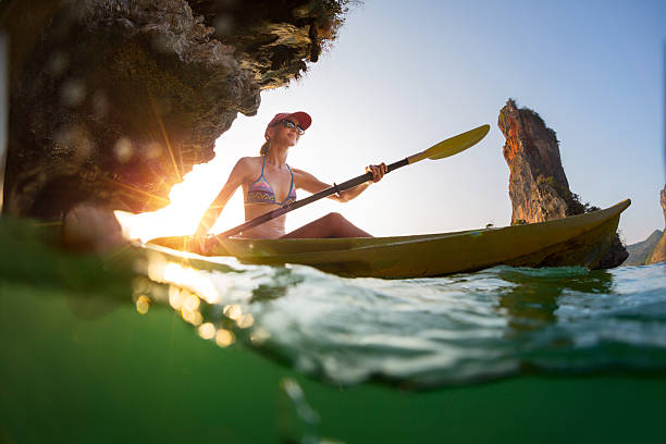istock Young lady paddling the kayak 497414016