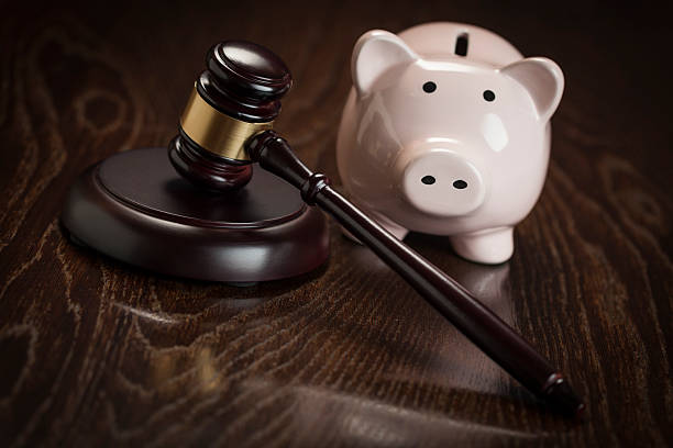 istock Gavel and Piggy Bank on Table 497415205