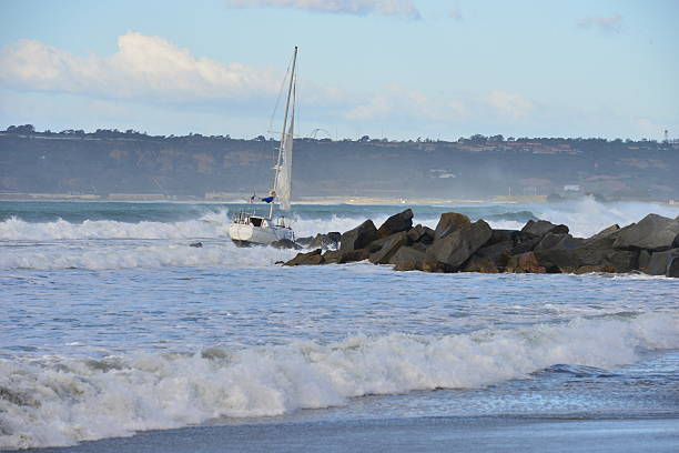 istock Yacht shipwrecked on beach. 497415262