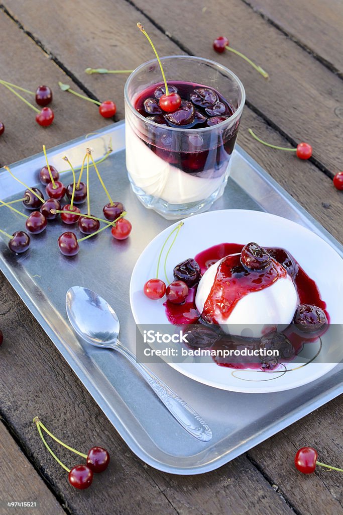 Italian panna cotta Selective focus on Italian traditional dessert panna cotta with cherries jelly Cherry Stock Photo