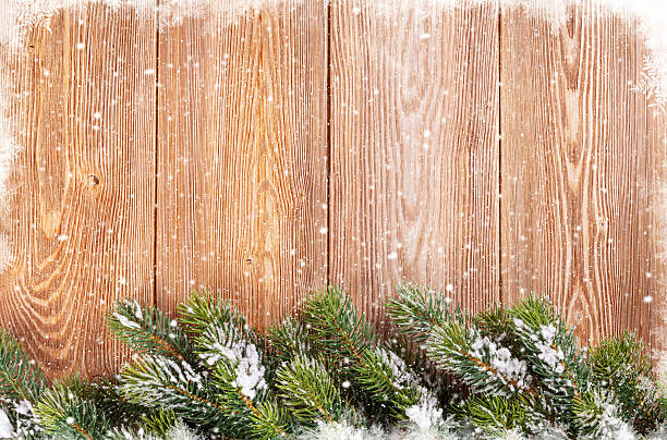 istock Christmas wooden background with snow fir tree 497416074