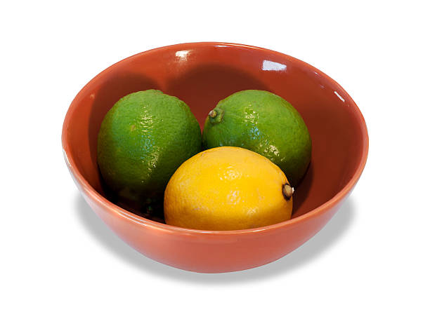 istock Two lime and lemon in brown bowl 497416165