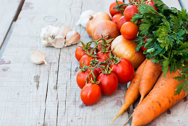 istock Autumn vegetables on the table - tomatoes, peppers, eggplant, zu 497416924