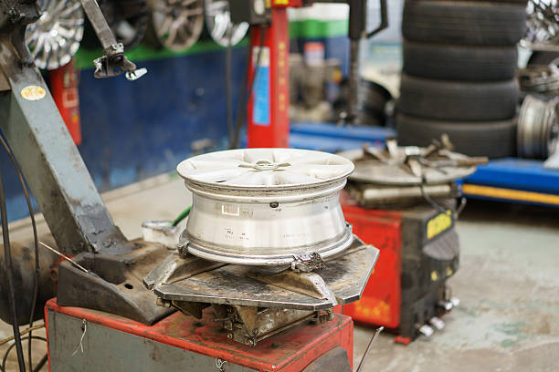 istock Mechanic is changing car tire 497418090