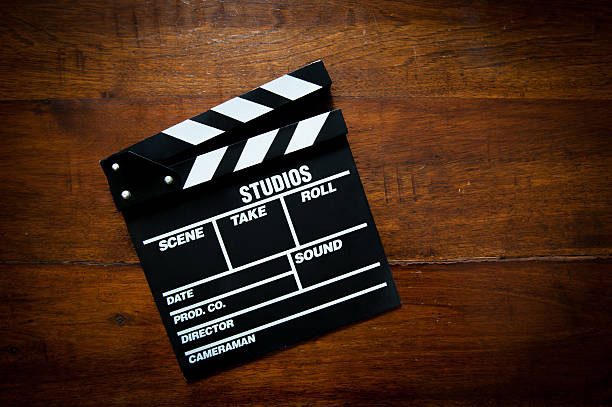 istock Movie clapper board on wood 497418534