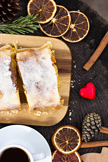 istock Strudel with custard and orange. Christmas Stollen. Christmas table decoration. 497418916