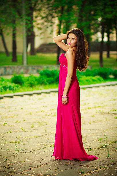 istock woman in red in park 497419314