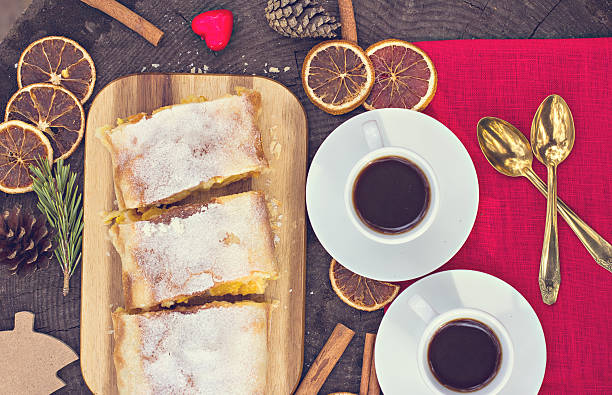 istock Strudel with custard and orange. Christmas Stollen. Christmas table decoration. 497420592