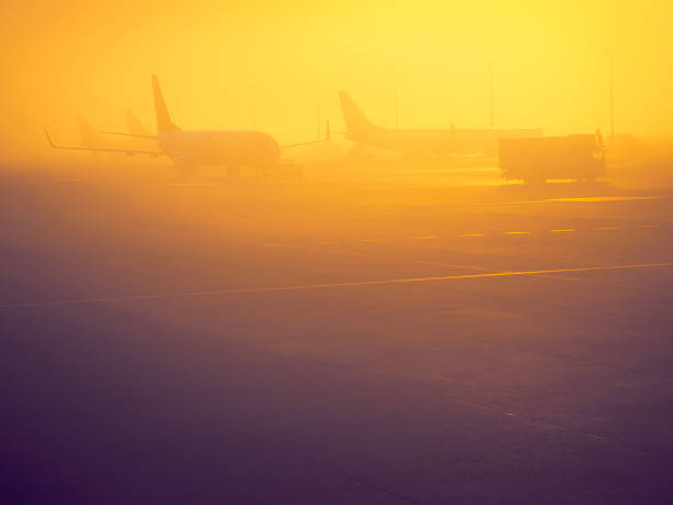 istock Airplane silhouettes in a fog 497420806