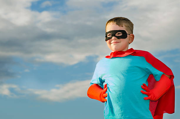 Child pretending to be a superhero stock photo