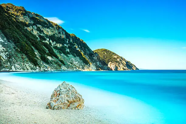 Rock in a blue sea. Sansone beach. Elba island. Tuscany, Italy. Long exposure photography