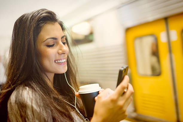 istock Young woman using a phone at train station in Sydney 497438754