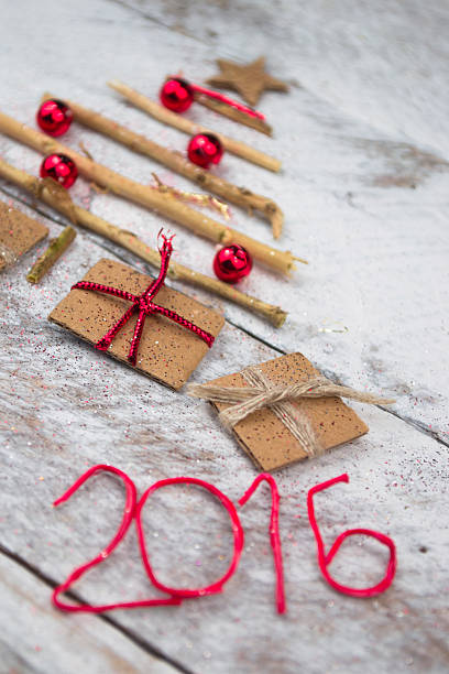 istock Christmas tree made of cardboard gift on wood background 497439820