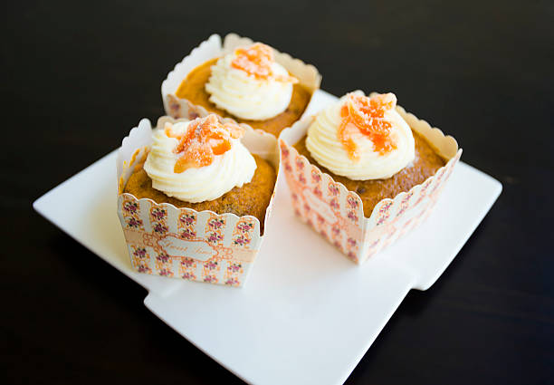 istock Carrot cupcake on the white plate in black background. 497440290