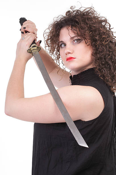 istock piercing woman curly girl and sword 497440420