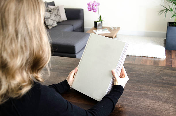istock Looking at the cover page of a blank book 497440946