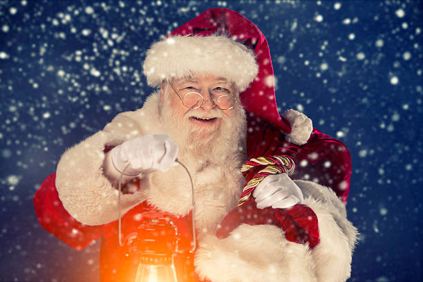 istock Santa Claus happy that it is snowing 497442046