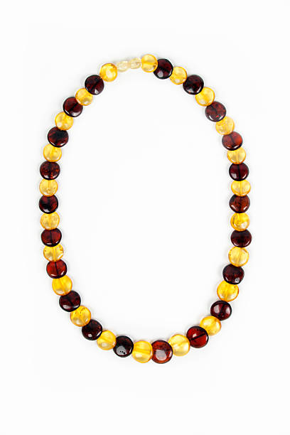 istock Amber beads close-up on a white background 497443028