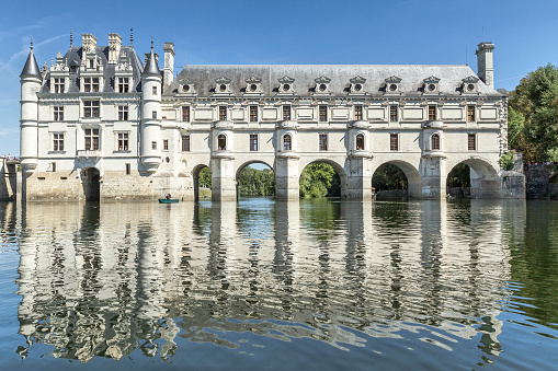 Chenonceau, France - August 21, 2015: Chateau de Chenonceau - Loire Valley - France - The current château was built in 1514–1522 on the foundations of an old mill and was later extended to span the river. The bridge over the river was built (1556-1559) to designs by the French Renaissance architect Philibert de l'Orme, and the gallery on the bridge (1570–1576) to designs by Jean Bullant.