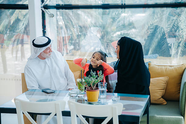 istock Traditional Arab family enjoying at cafe 497445318