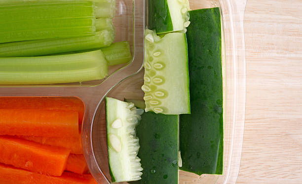 istock Carrots celery and cucumbers in plastic tray 497445424