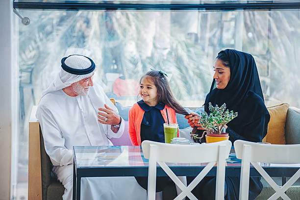 istock Traditional Arab family enjoying at cafe 497445662