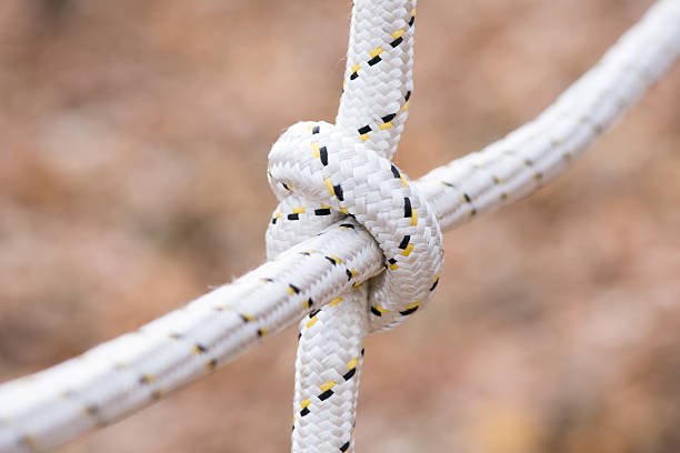 istock Rope with a tied knot - copy space, selective focus 497446036