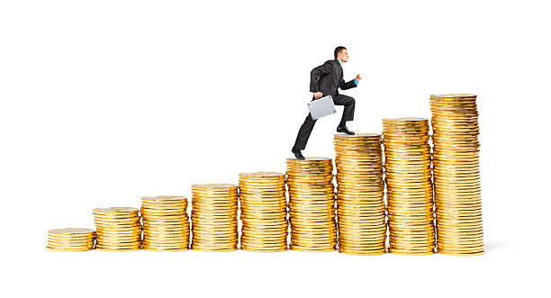 istock Businessman goes up the gold coins 497446292