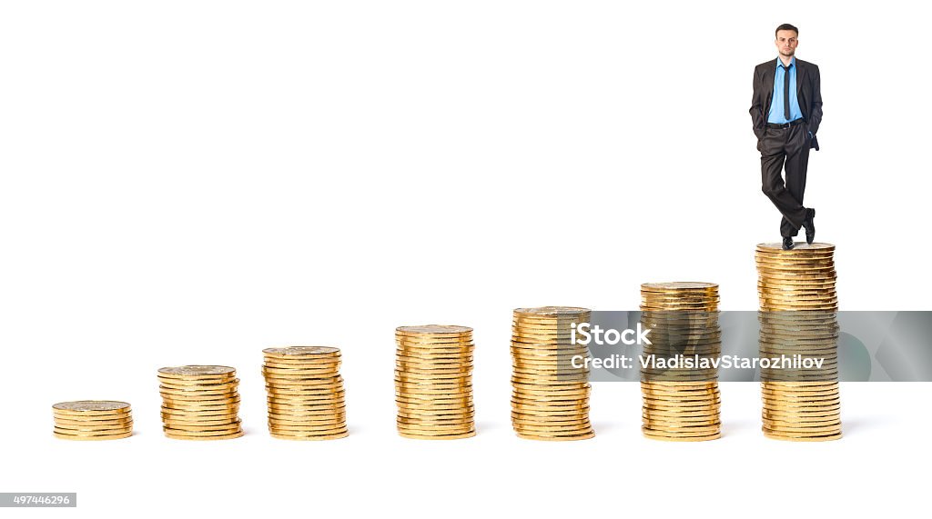 Businessman on top the gold coins Businessman on top the gold coins on a white background Achievement Stock Photo