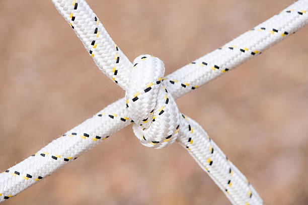istock Rope with a tied knot - copy space, selective focus 497446578
