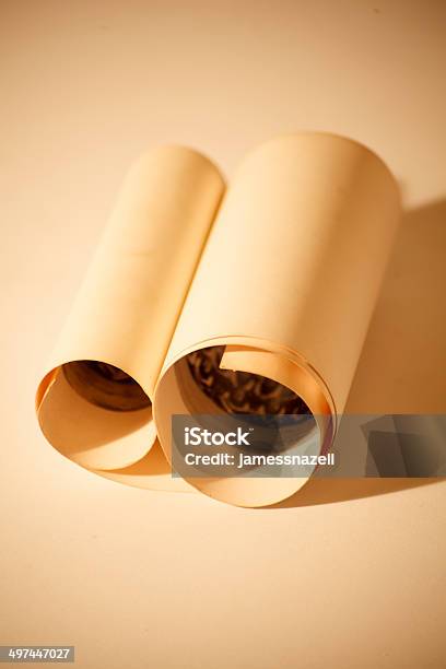 Vintage Scroll Against A Sepia Background Stock Photo - Download Image Now - 1930-1939, 1940-1949, 1950-1959