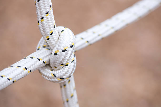 istock Rope with a tied knot - copy space, selective focus 497447648
