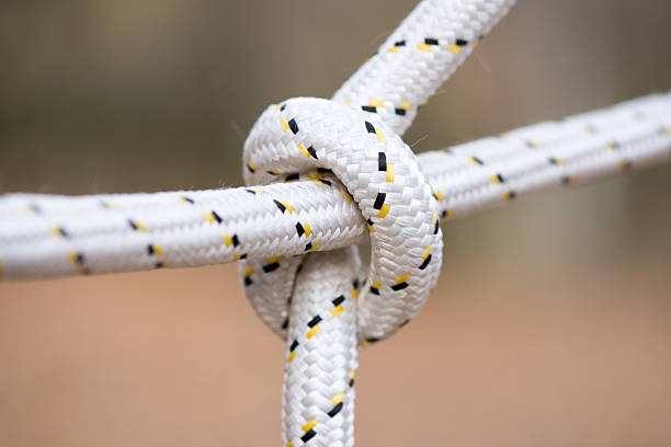 istock Rope with a tied knot - copy space, selective focus 497447842
