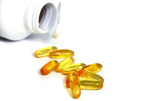 istock Omega Fish Oil Supplement Capsules Spilling 497448317