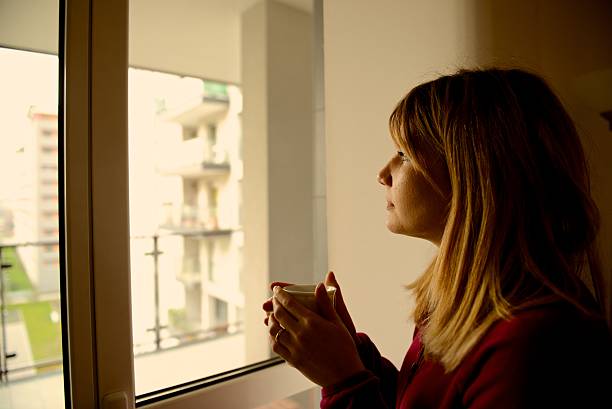 istock Blond girl look outside 497448461