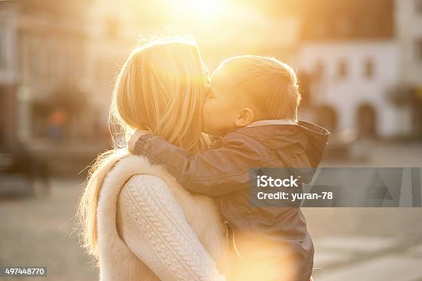 Happiness Mother And Son On The Street At Sunny Day Stock Photo - Download Image Now