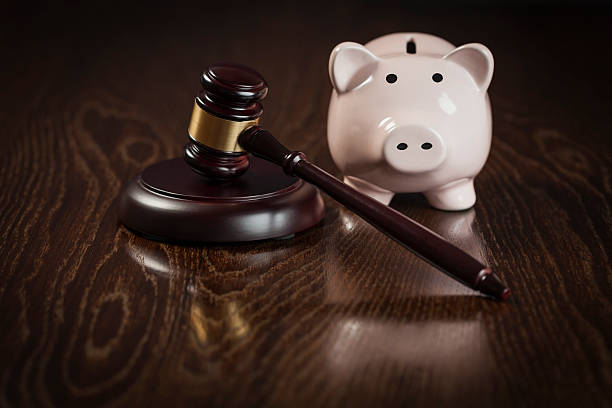 istock Gavel and Piggy Bank on Table 497449987