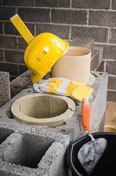 istock Construction of modular ceramic chimney in the house 497450728