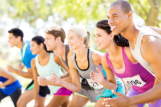 istock Friends Running In Marathon Race 497451075