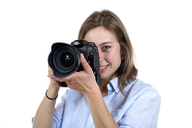 istock girl take a photo with digital camera 497451337
