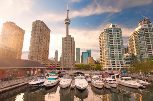 View of the harbour front marina with toronto skyline in the background at sunset