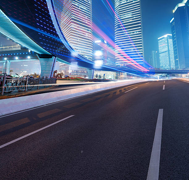 istock Asphalt road and modern city 497466163