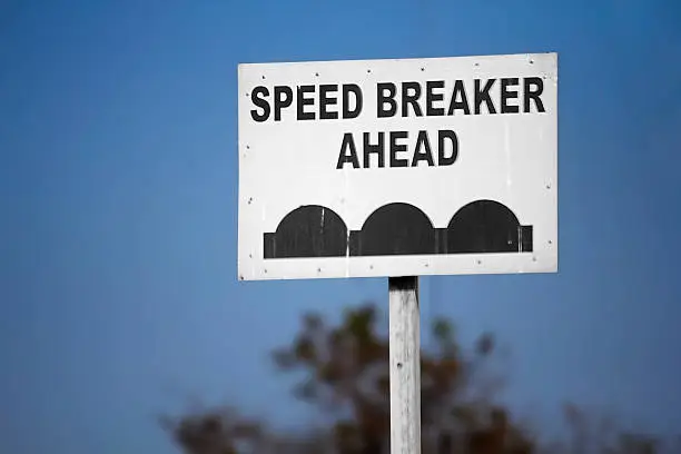 Traffic sign board of speed breakers ahead