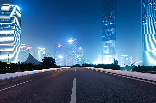 istock Asphalt road and modern city 497466213