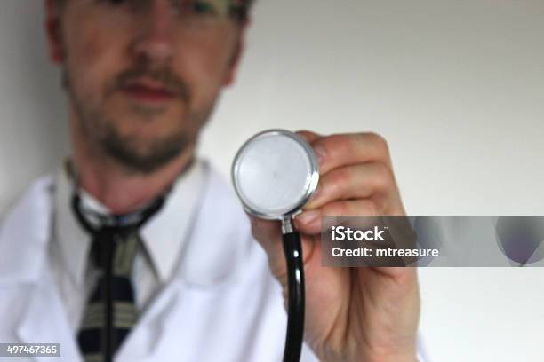 Image Of Hospital Doctors Stethoscope With Blurred Doctor In Background Stock Photo - Download Image Now