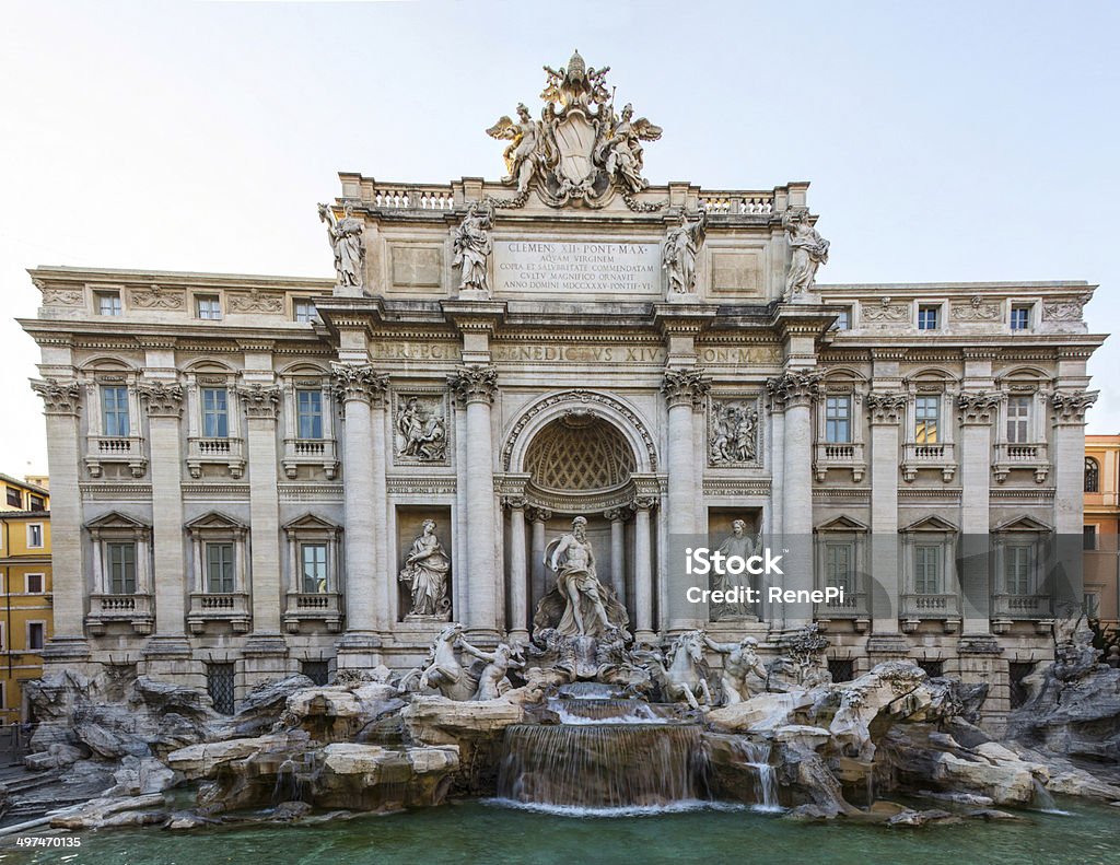 Trevi Fountain Taken on June 8th, 2014 - Visited Rome from June 6th to 9th. Absolutely amazing architecture throughout the whole city from one place to another. This place is usually pretty crowded and there was also a fence around the fountain because they started to renovate it around those days I've been there. Anyway I'm quite satisified with the result of this pano. Fountain Stock Photo