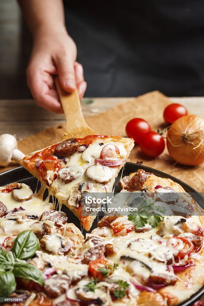 Pizza Pizza topped with cheese, sausage and cherry tomato Cheese Stock Photo