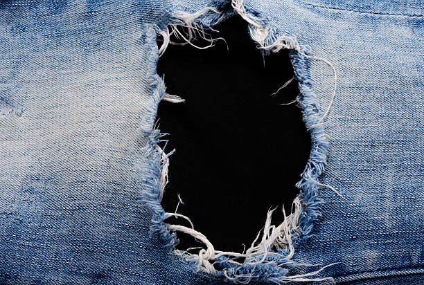 Space for text Blue denim of jeans texture with space for text hole in pants stock pictures, royalty-free photos & images