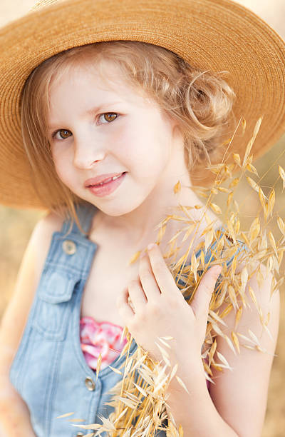 istock Cute girl holding dry grass 497471415